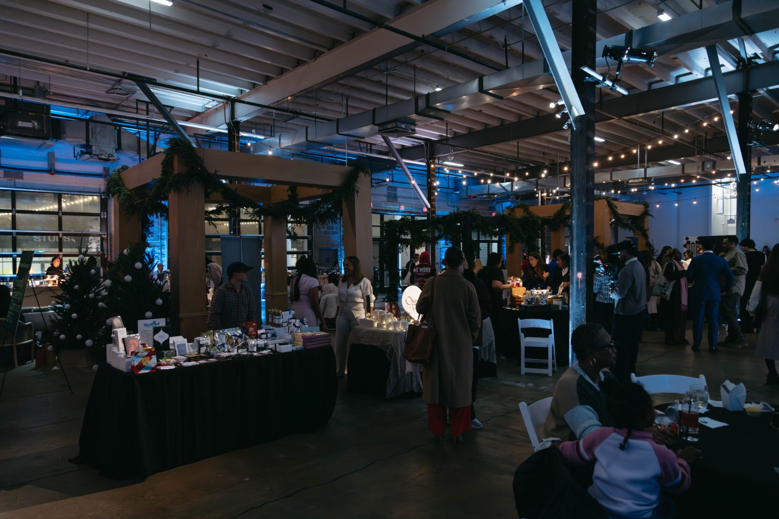 A holiday market venue with string lights